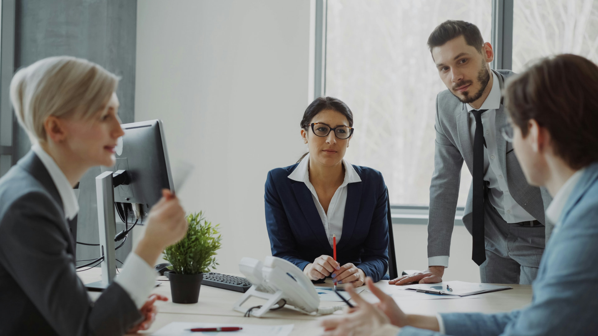 Professionals in a modern office meeting